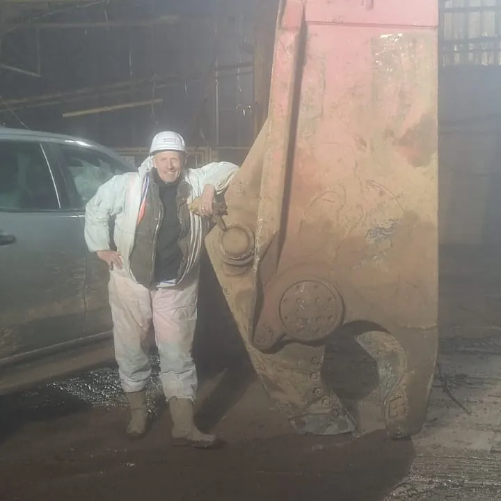 John Mitchell - Beside a Steel Cutting Shear Attachment which is fitted to a 50 Tonne Excavator John is operating on site